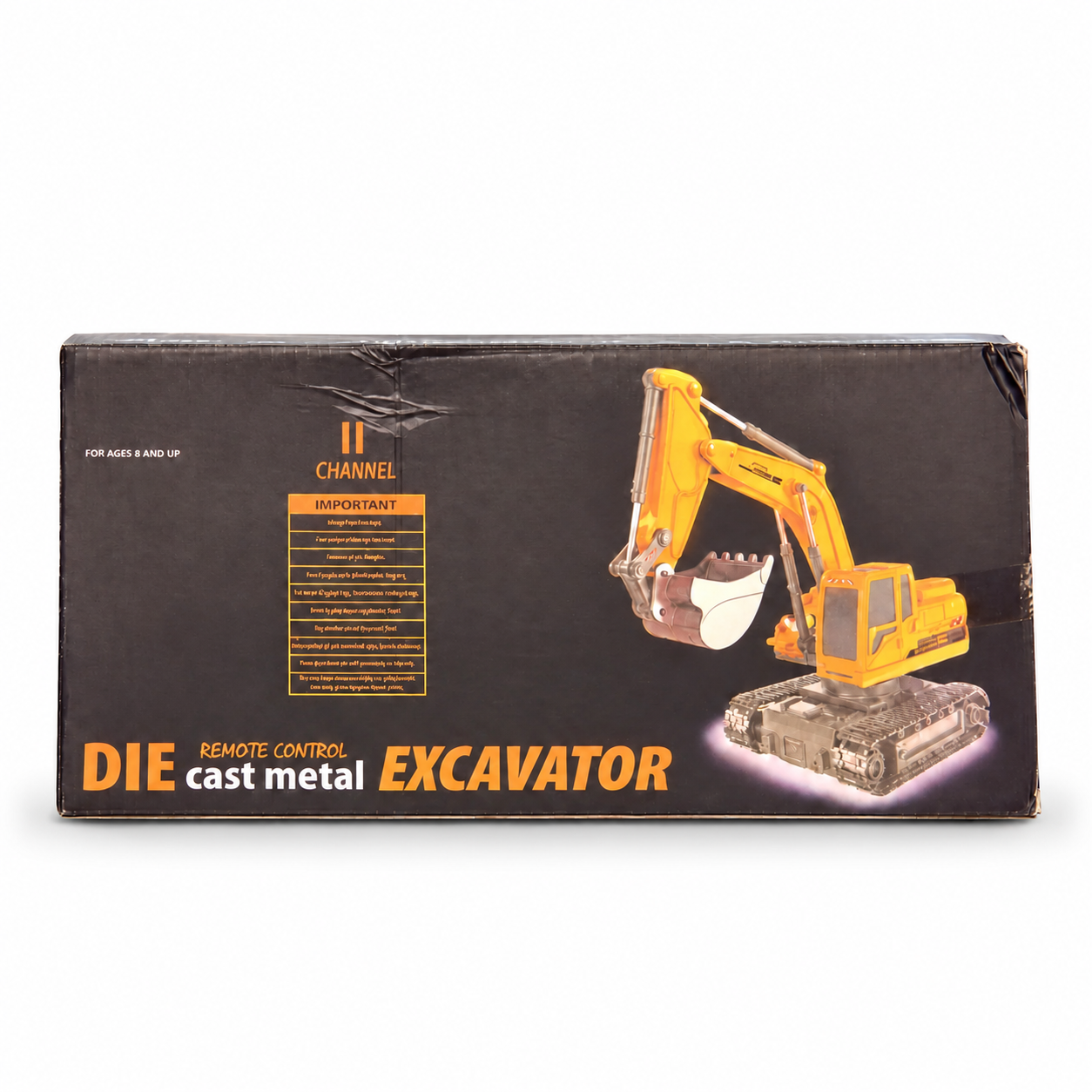 Original boxed remote-control yellow excavator toy with tracked-base construction vehicle pictured on the package