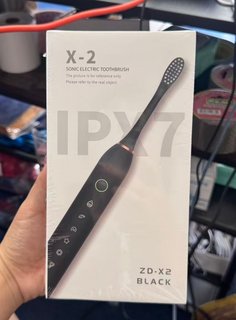 X-2 / ZD-X2 black sonic electric toothbrush — actual retail packaging photo